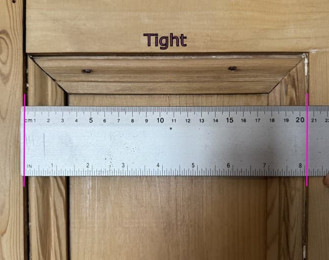 Ruler measuring the tight, outer opening of a window frame